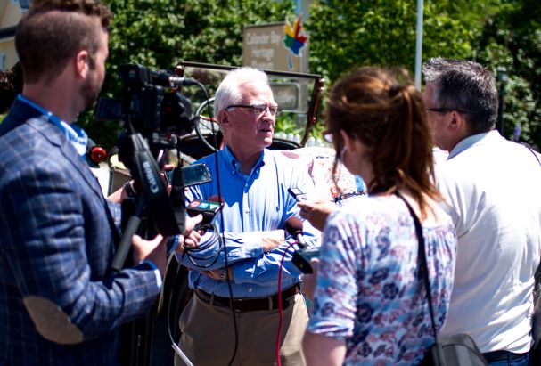 John Butte being interviewed by reporters